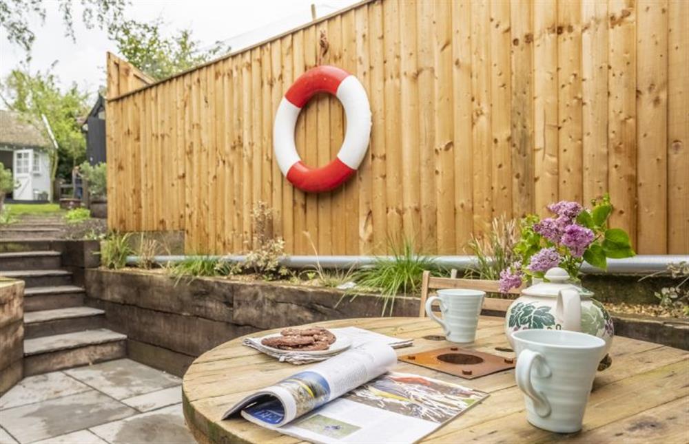 The summerhouse is just beyond the outdoor dining table