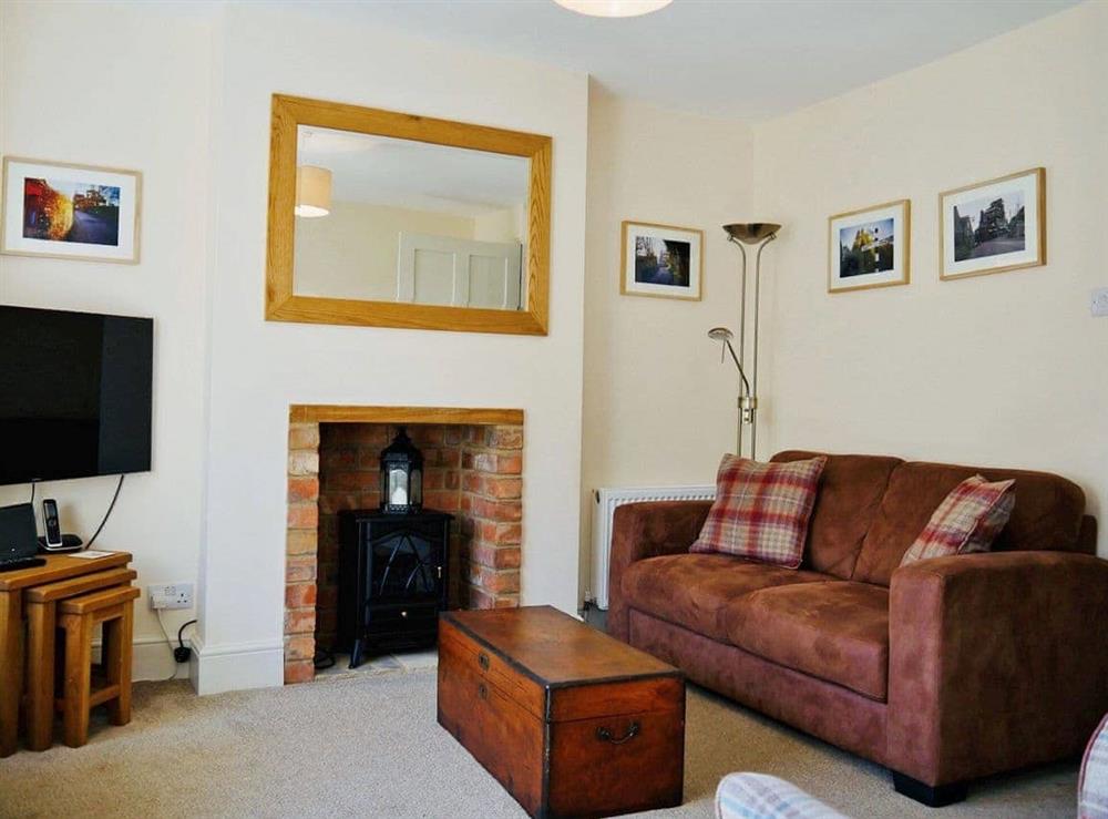 Ample comfy seating in lounge at Wells Cottage in Hook Norton, near Chipping Norton, Oxfordshire