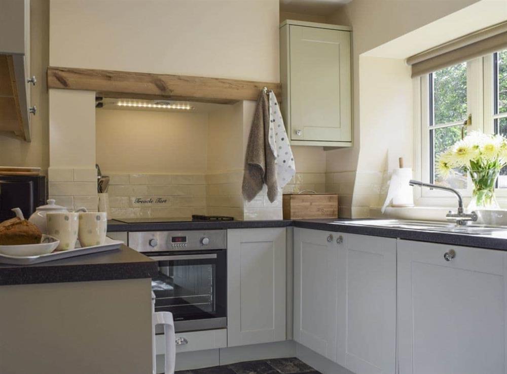 Well-equipped fitted kitchen at Wells Cottage in Hook Norton, near Chipping Norton, Oxfordshire