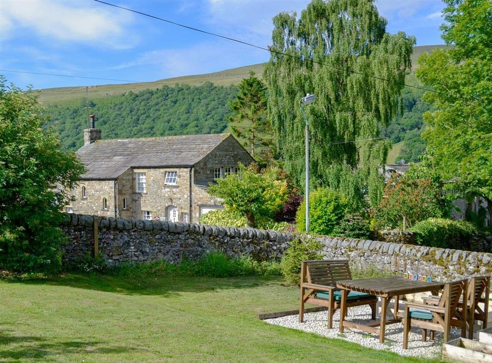 Lawned garden with wonderful views of the surrounding area at Wellside Cottage in Starbotton, near Kettlewell, North Yorkshire
