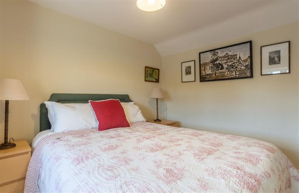First floor: Bedroom two with a king-size bed (photo 2) at Wensum Farm Cottage, West Rudham near Kings Lynn