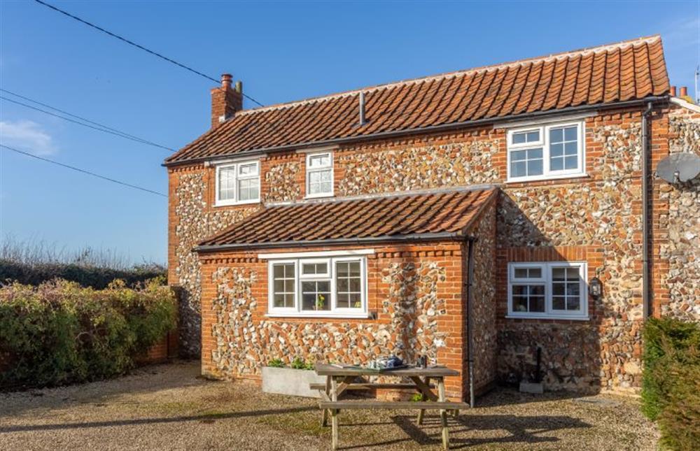 Wensum Farm Cottage: Front elevation with courtyard area at Wensum Farm Cottage, West Rudham near Kings Lynn