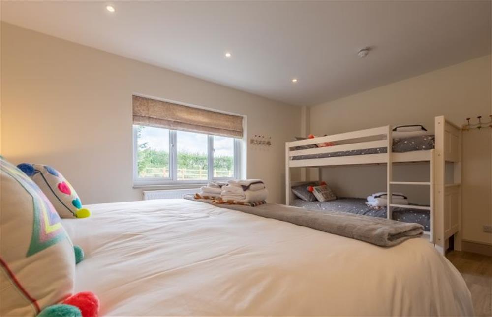 Family bedroom with zip and link Super-king size bed and bunk bed at Wensum Retreat, South Raynham near Fakenham