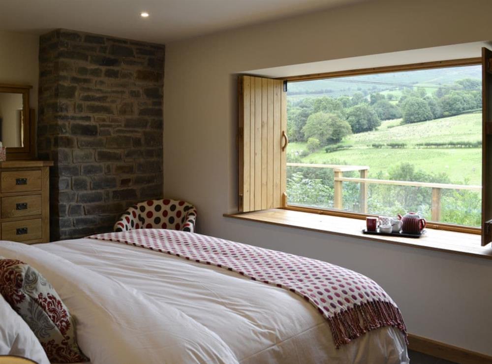 Bedroom overlooking spectacular scenery at Wern Ddu Cottage in Penybontfawr, near Oswestry, Powys