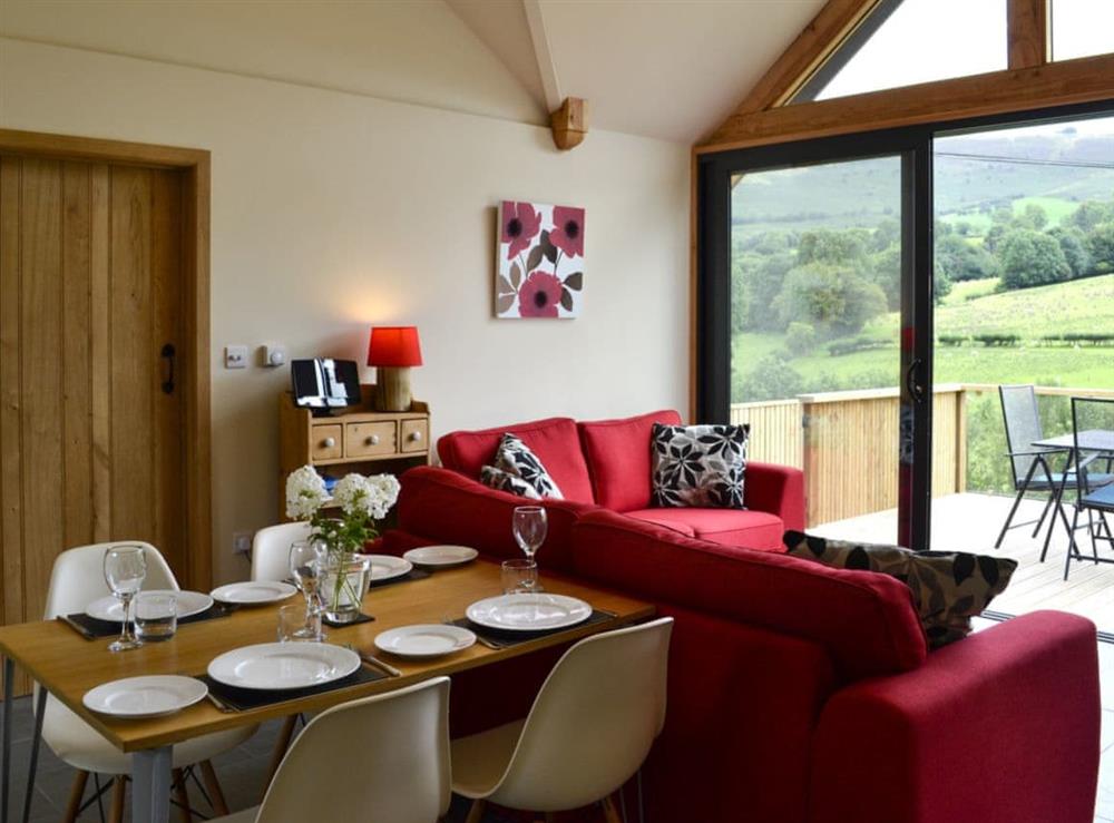 Inviting dining open plan living space at Wern Ddu Cottage in Penybontfawr, near Oswestry, Powys
