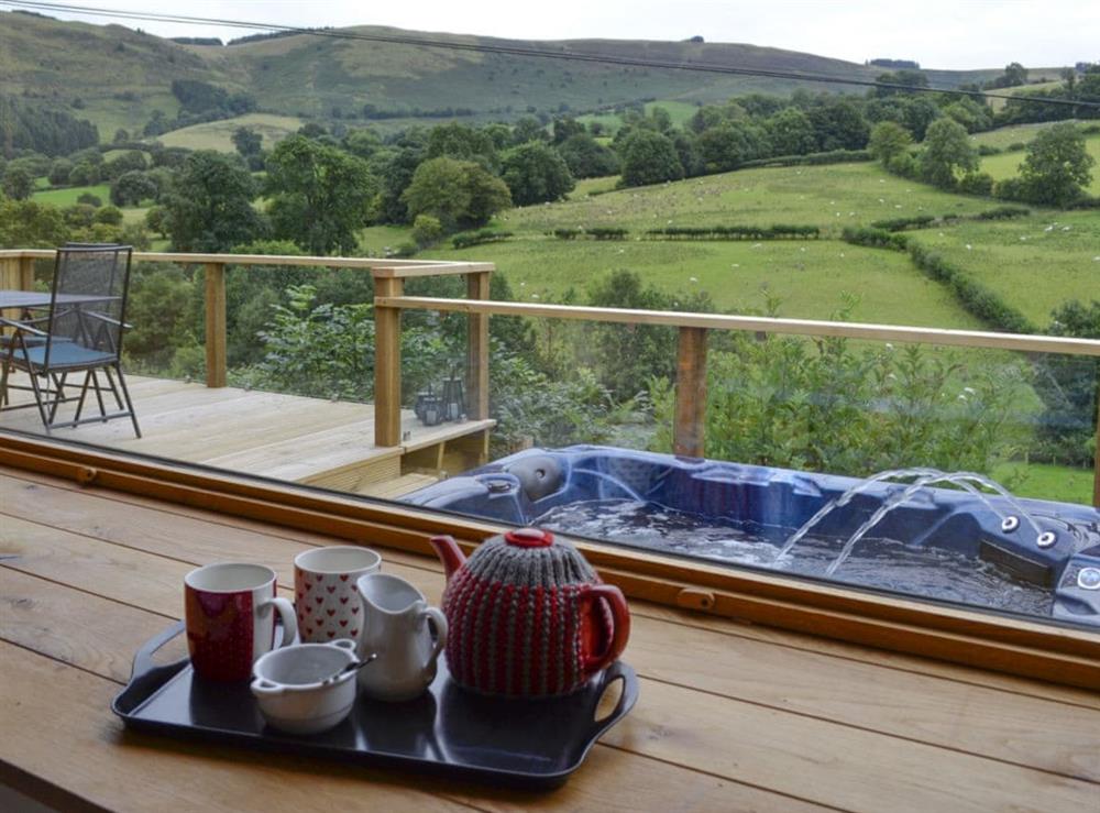 Spectacular views from the impressive picture widows in the bedroom at Wern Ddu Cottage in Penybontfawr, near Oswestry, Powys