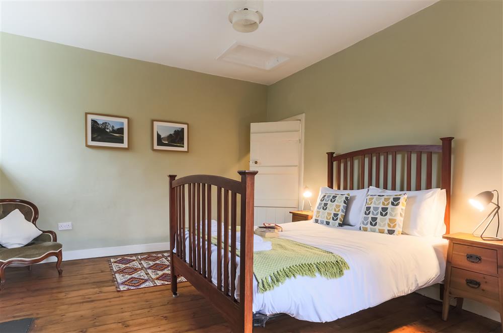 Bedroom one with a 4’6 double bed at Wern Manor and Cottages, Porthmadog