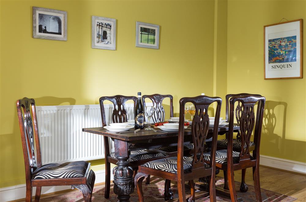 Bright dining area seating six guests at Wern Manor and Cottages, Porthmadog