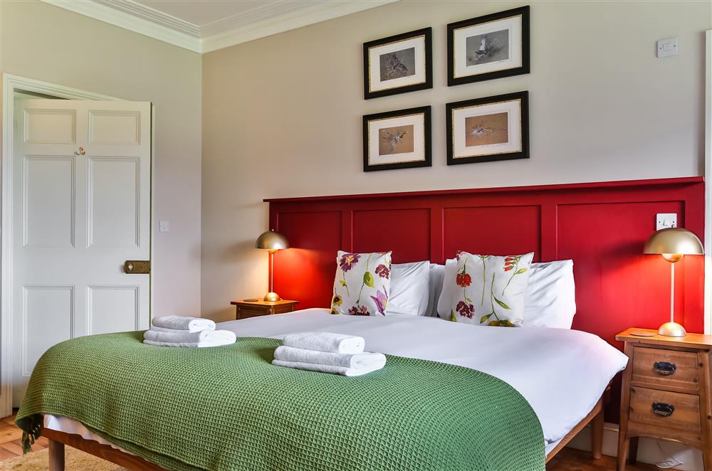 Housekeeper’s bedroom with bold touches of colour at Wern Manor and Cottages, Porthmadog