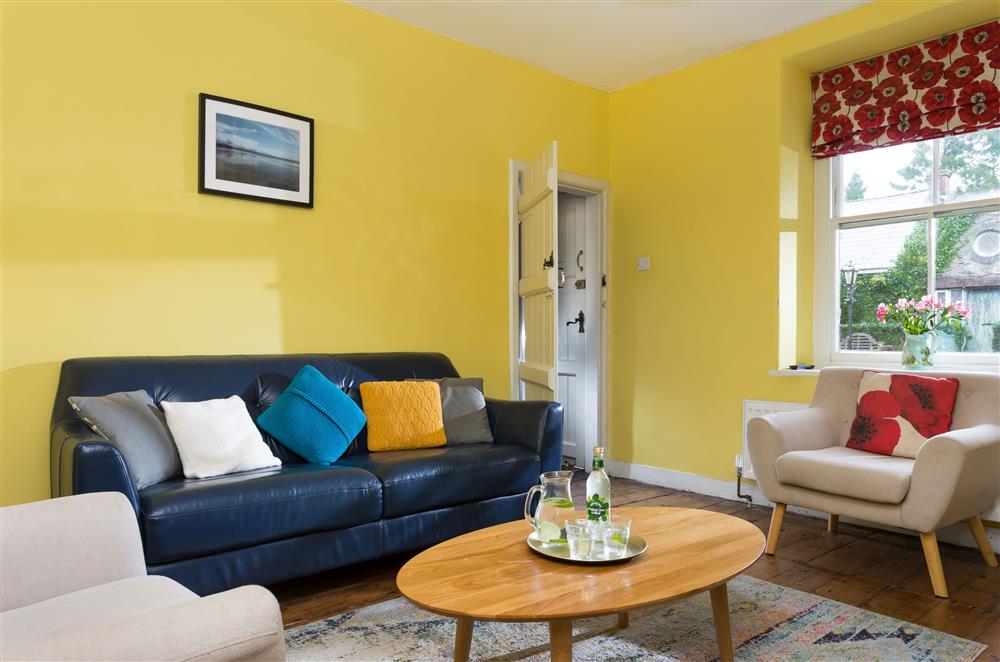 Relax on the comfortable seating in the sitting room at Wern Manor and Cottages, Porthmadog