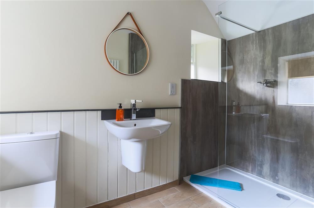 Brushing Rooms bedroom’s en-suite shower room with a walk-in shower at Wern Manor, Porthmadog
