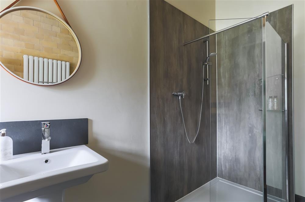 Larder bedroom’s en-suite shower room with a walk-in shower at Wern Manor, Porthmadog
