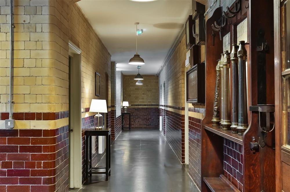 Original glazed brick corridor leading to the bedrooms, dining room, kitchen and atrium at Wern Manor, Porthmadog