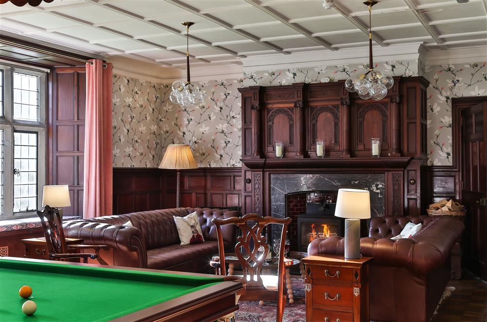 Sitting room with sumptuous seating and views of Moel y Gest at Wern Manor, Porthmadog