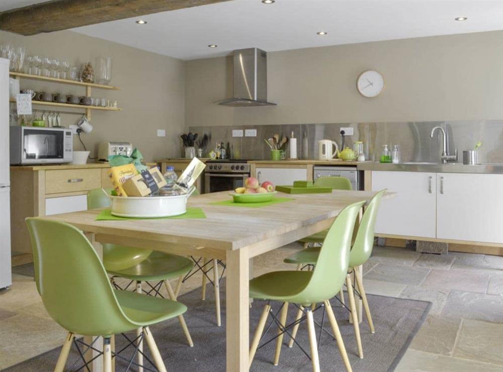 Convenient dining area within contemporary kitchen/diner at West Barn in Holymoorside, near Chesterfield, Derbyshire