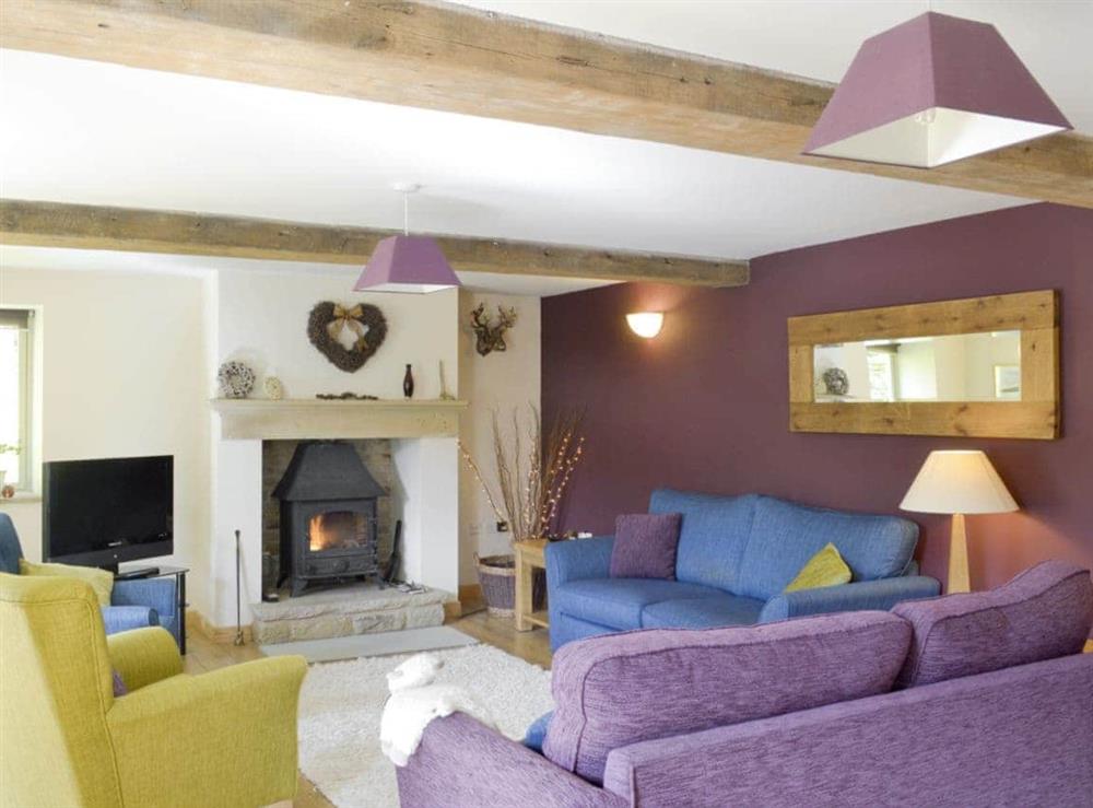 Warm and welcoming living room at West Barn in Holymoorside, near Chesterfield, Derbyshire