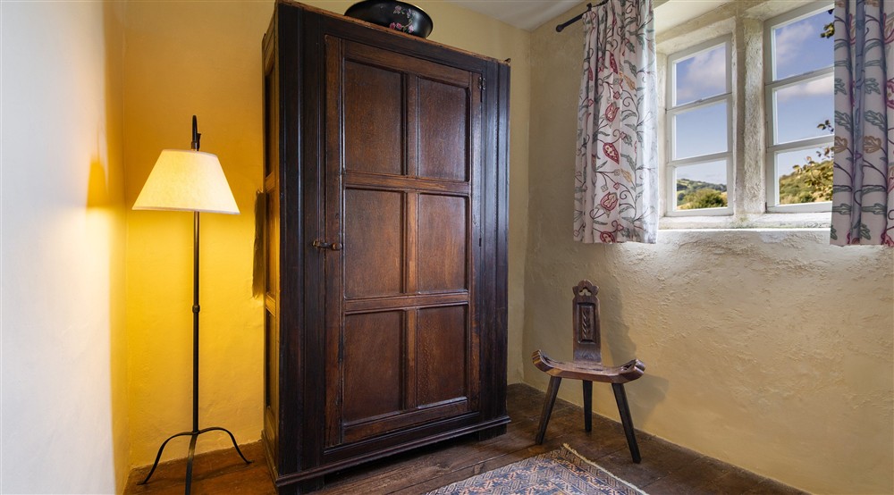 The double bedrooms dressing room with wardrobe at West Challacombe Manor in West Exmoor, Devon