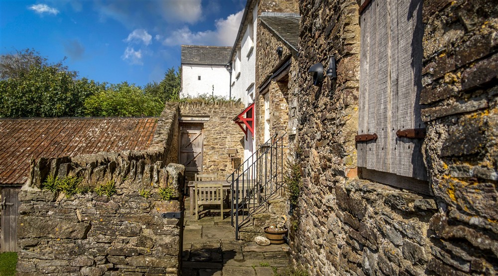 The terrace and main entrance at West Challacombe Manor in West Exmoor, Devon