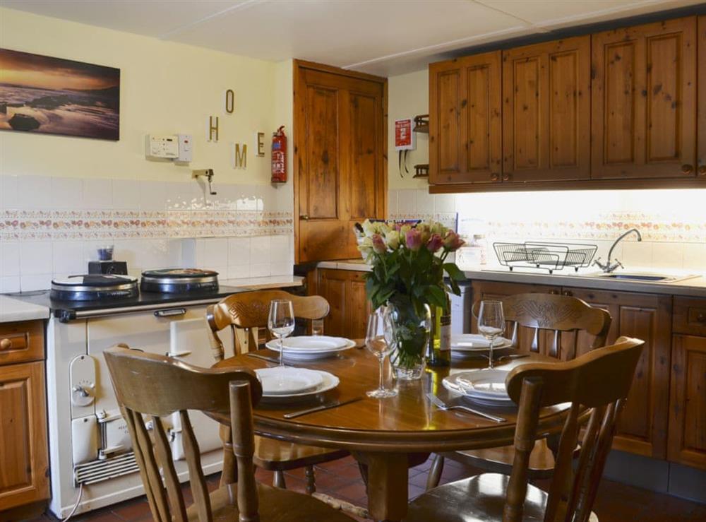 Well-equipped kitchen and dining area (photo 2) at West End Cottage in Carrbridge, near Aviemore, Highlands, Inverness-Shire