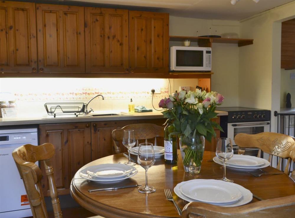 Well-equipped kitchen and dining area at West End Cottage in Carrbridge, near Aviemore, Highlands, Inverness-Shire