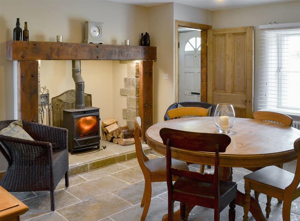 Wonderful dining room with wood burner (photo 2) at West End Cottage in Whittingham, near Alnwick, Northumberland