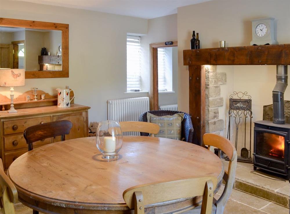 Wonderful dining room with wood burner at West End Cottage in Whittingham, near Alnwick, Northumberland