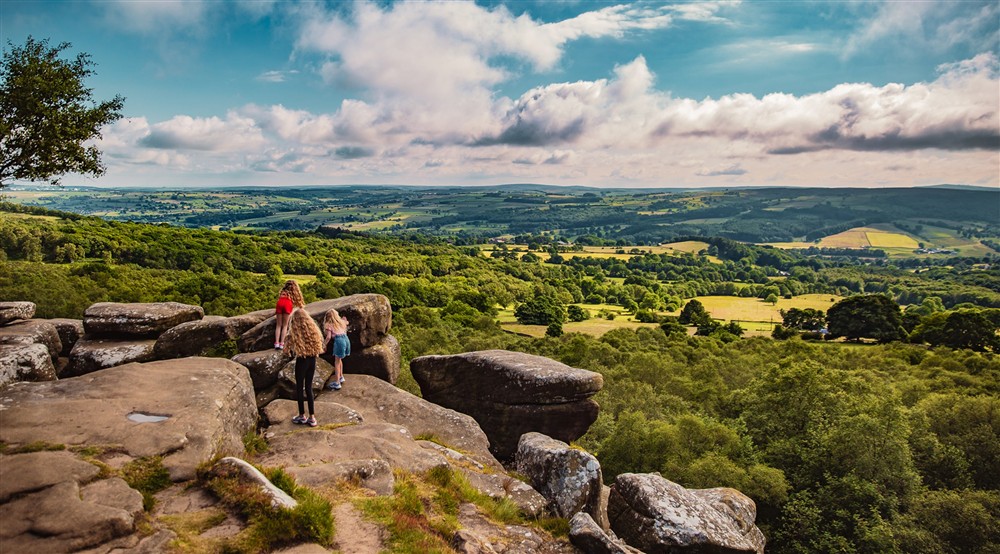Children explore Brimham Rocks overlooking Nidderdale AONB at West Gate Lodge in Ripon, North Yorkshire