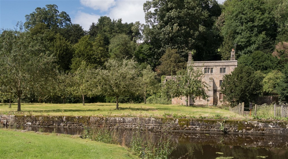 The view from across the orchard to the back of West Gate Lodge, Yorkshire at West Gate Lodge in Ripon, North Yorkshire