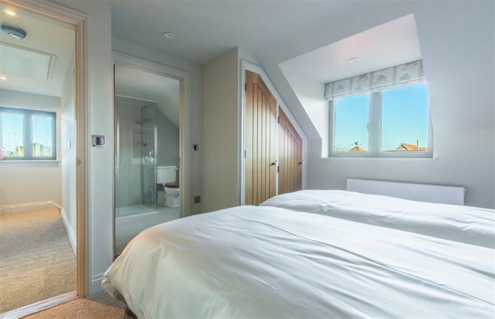 First floor: Bedroom two has en-suite shower room at West Heath, Brancaster Staithe near Kings Lynn