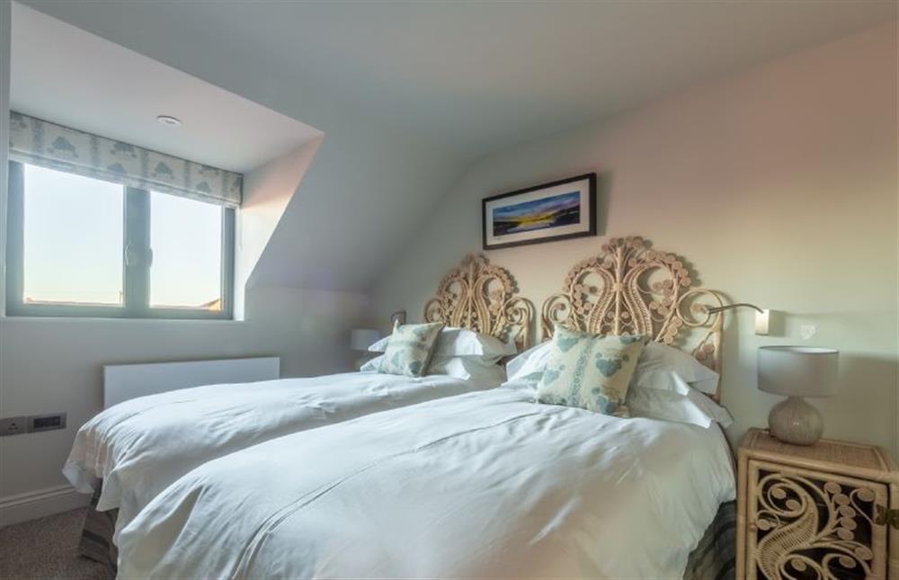 First floor: Bedroom two has full size twin beds at West Heath, Brancaster Staithe near Kings Lynn