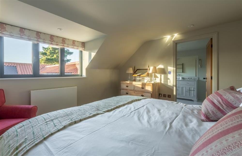 First floor: Master bedroom has en-suite bathroom at West Heath, Brancaster Staithe near Kings Lynn