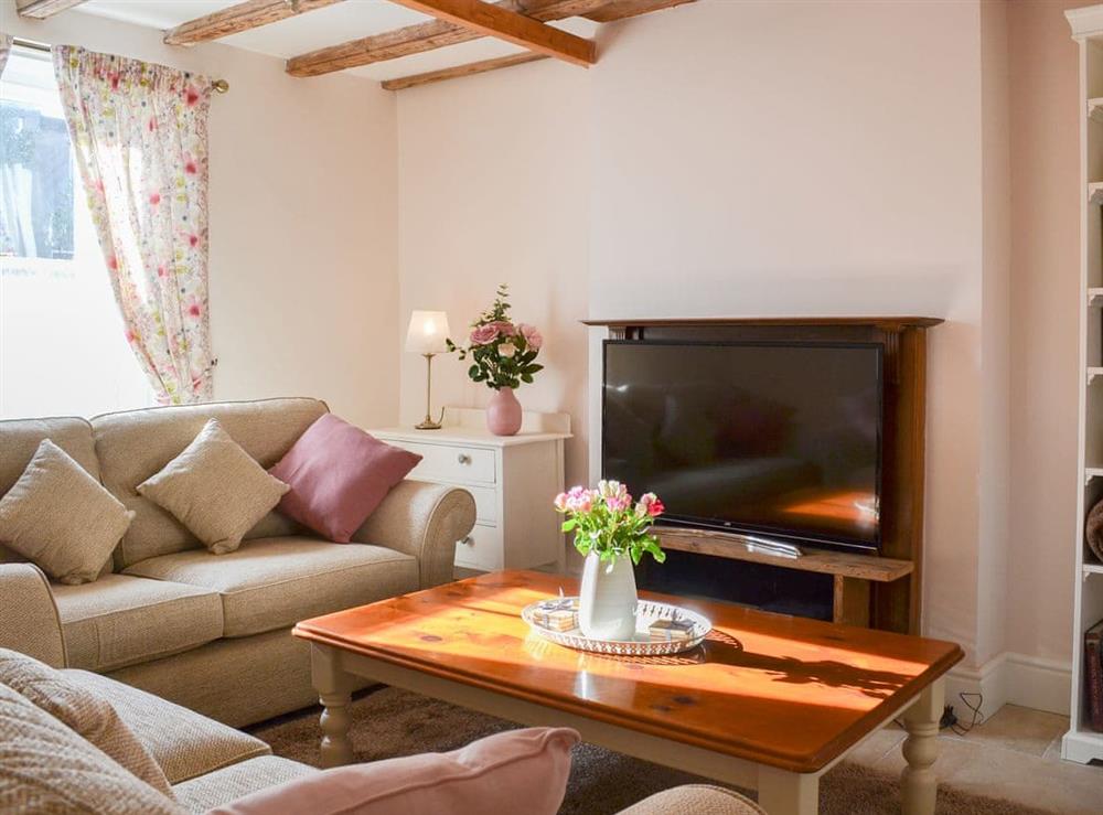 Charming beamed living room at West House Farm in Muston, near Filey, North Yorkshire