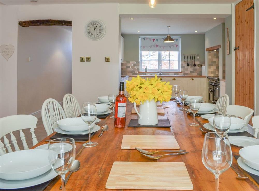 Delightful dining room and adjacent kitchen at West House Farm in Muston, near Filey, North Yorkshire