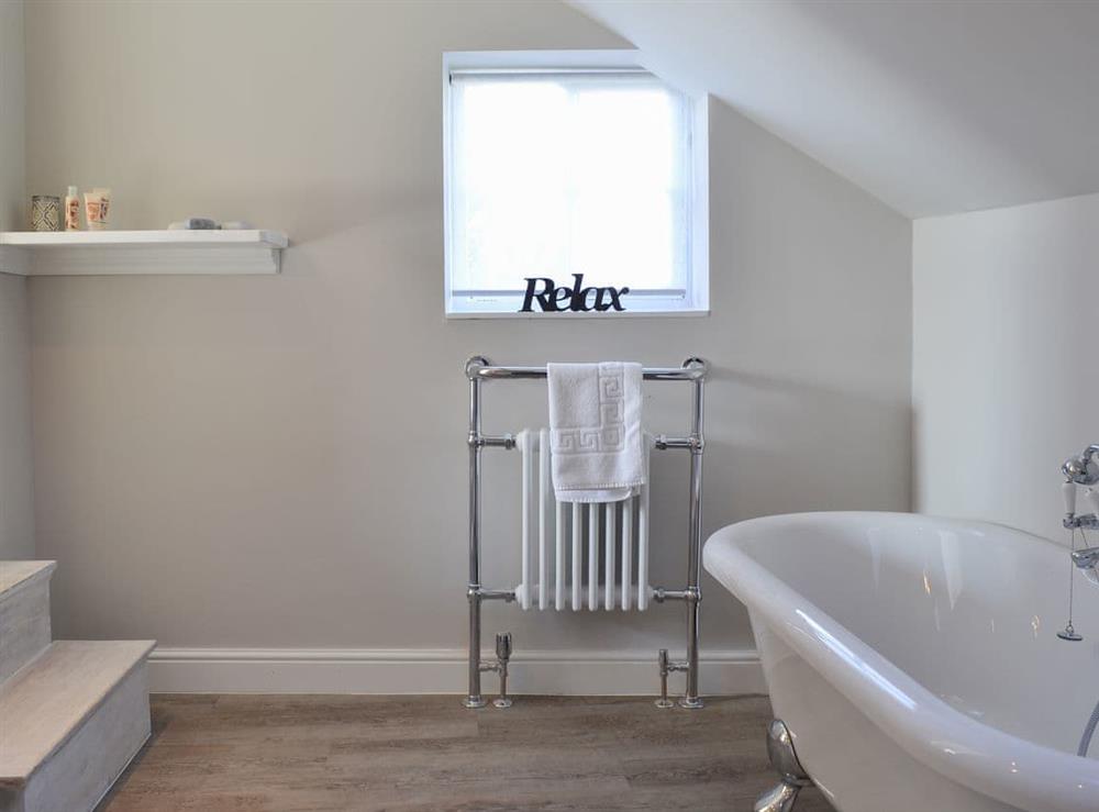 En-suite bathroom with heated towel rail at West House Farm in Muston, near Filey, North Yorkshire