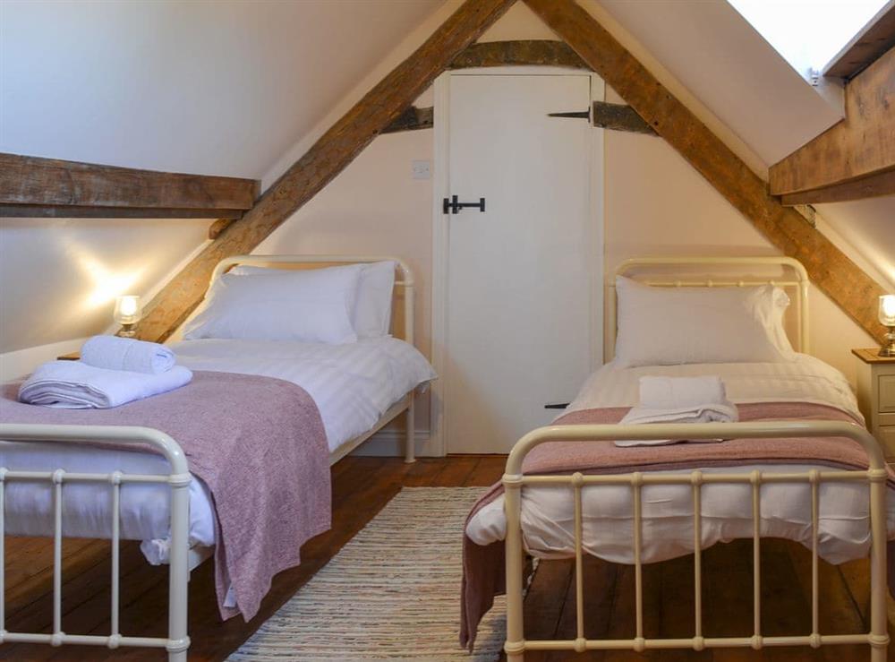 Lovely bedroom with twin beds at West House Farm in Muston, near Filey, North Yorkshire