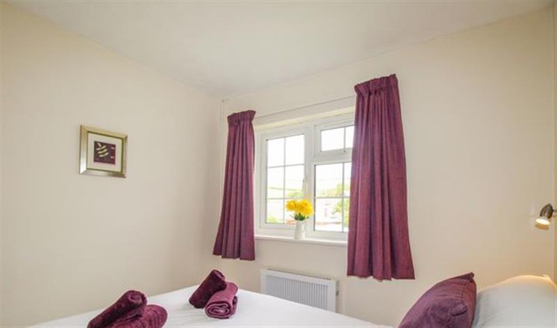 This is a bedroom at West Lulworth Apartment, West Lulworth