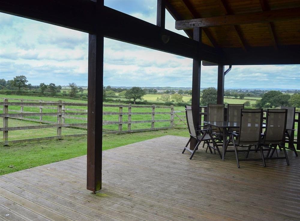 Large covered decked area overlooking open fields at Otter, 