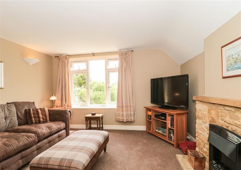 Relax in the living area at West Moor Cottage Annex, Burrow Hill