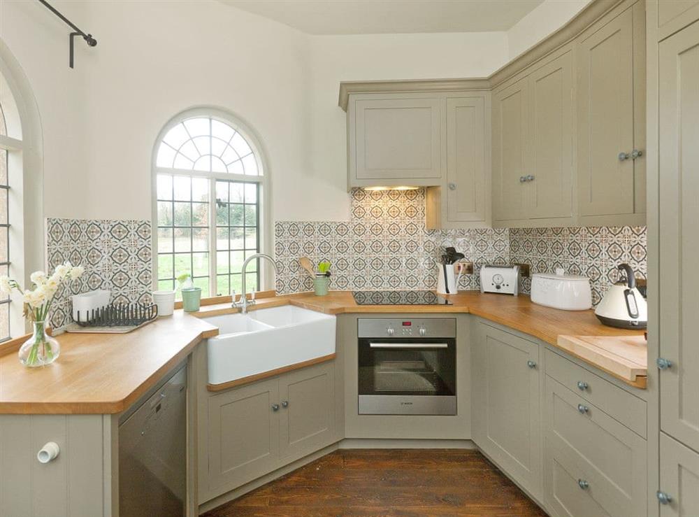 Stylish kitchen at West Pepperpot Lodge in Wimborne St Giles, England