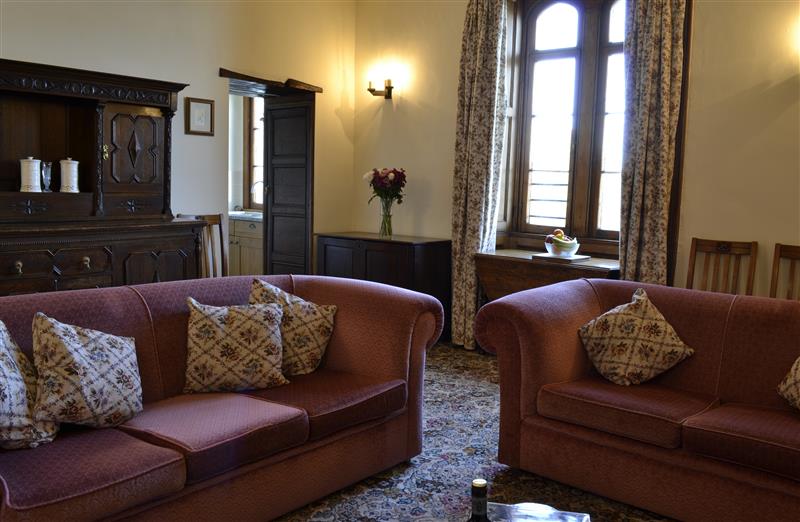 Relax in the living area at West Tower Apartment, Berrynarbor near Ilfracombe