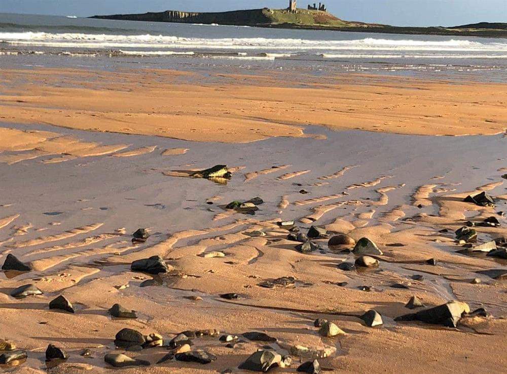 Dunstanburgh Castle and nearby beach at West View Cottage in Seahouses, Northumberland