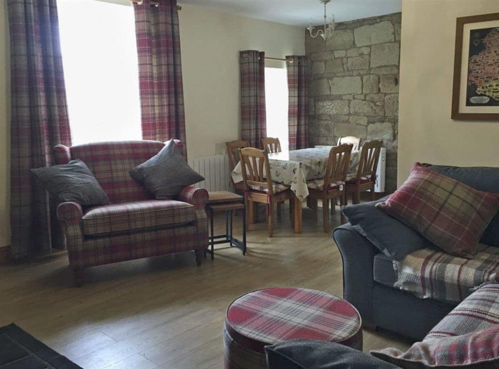 Spacious living and dining area at West View Cottage in Seahouses, Northumberland