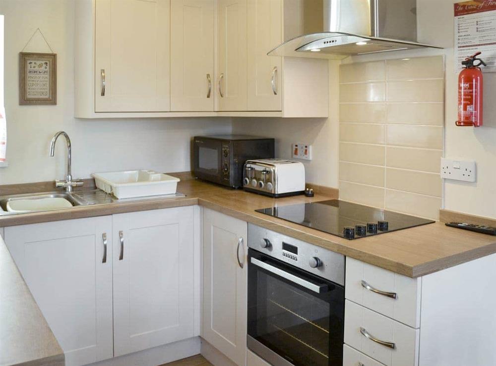 Well-equipped fitted kitchen at West View Cottage in Seahouses, Northumberland