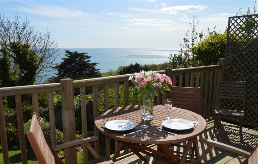 Decked balcony off the kitchen/dining with view across the sea at West Winnowing, Niton Undercliff