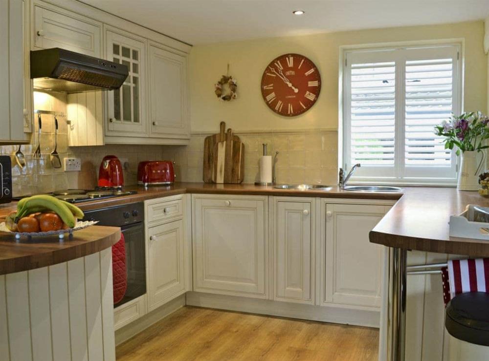 Spacious fitted kitchen with breakfast bar at West Wood Barn in Sutton-upon-Derwent, Nr York., North Yorkshire