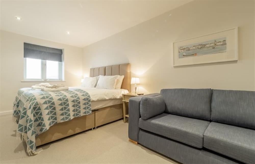 Bedroom two with twin single beds, en-suite, sofa bed and sea views at Westaway, Portreath
