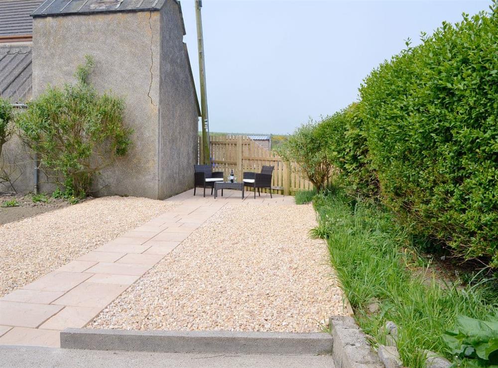 Paved and gravelled patio leading to an additional outdoor seating area at Westcliff in Whitehills, near Banff, Aberdeenshire