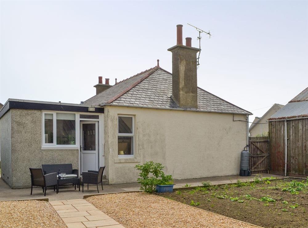 Rear of property with garden and patio area at Westcliff in Whitehills, near Banff, Aberdeenshire