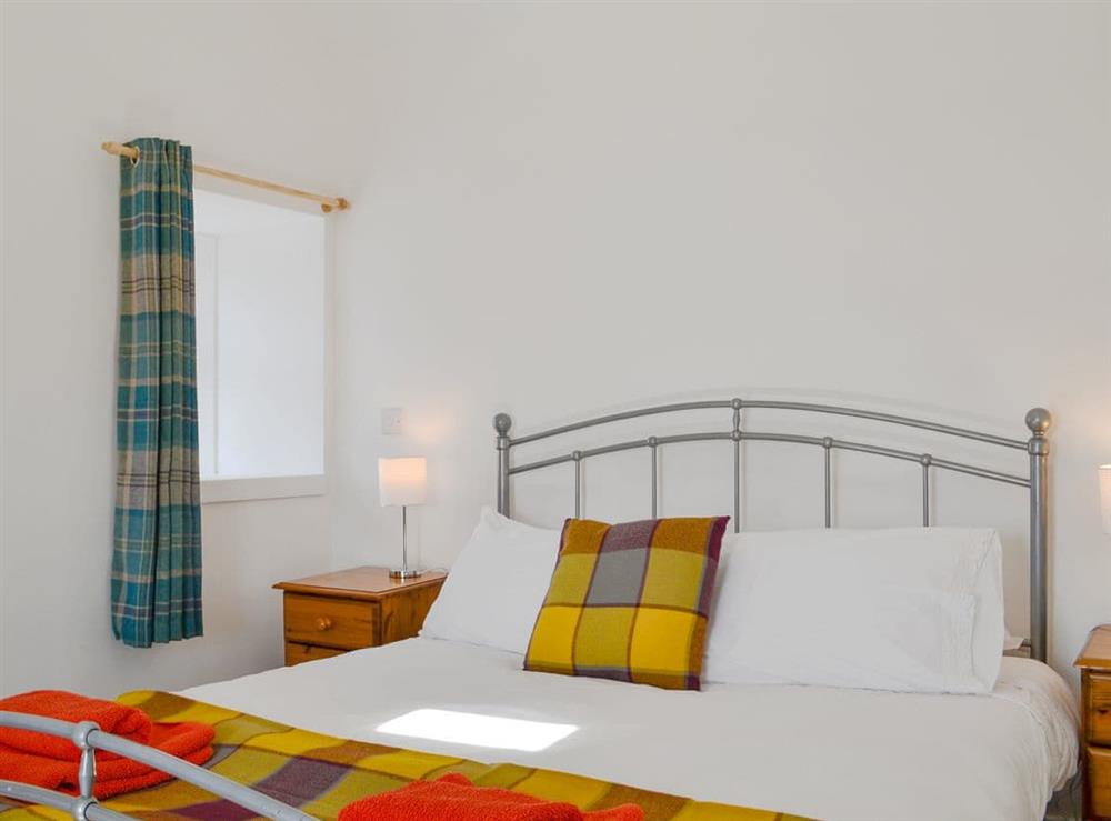 Comfortable bedroom with kingsize bed at Wester Laggan Cottage in Dulnain Bridge, near Grantown-on-Spey, Highlands, Morayshire