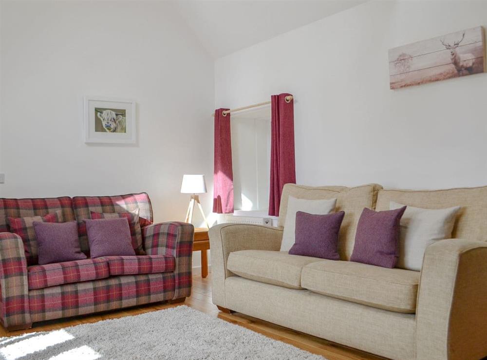 Comfortable living room at Wester Laggan Cottage in Dulnain Bridge, near Grantown-on-Spey, Highlands, Morayshire